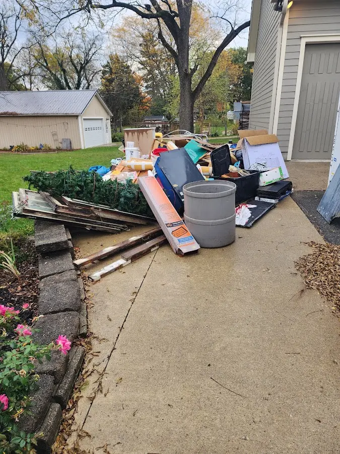 Dumpster being loaded with debris for 10 Yard Dumpster Rental in Butler Beach